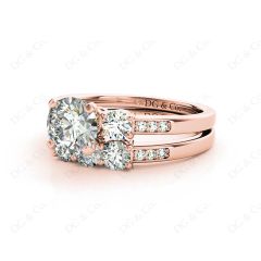 Round Cut Diamond trilogy wedding set rings with claw set side stone in 18K Rose