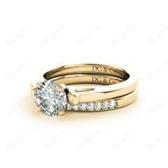 Round cut diamond wedding set rings with channel set shoulders in 18K Yellow