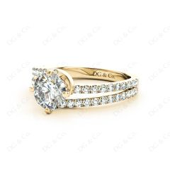 Round Cut Split Shank Diamond Engagement Ring with a Twist Band and Pave Set Side Stones in 18K Yellow