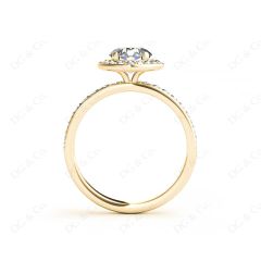 Round cut halo diamond engagement ring with four claw setting in 18K Yellow