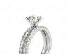 Round Cut Diamond Engagement ring with claw set centre stone in Platinum