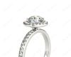 Round cut halo diamond engagement ring with four claw setting in 18K White