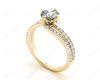 Round Cut Split Shank Diamond Engagement Ring with a Twist Band and Pave Set Side Stones in 18K Yellow