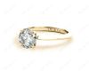 Round Cut Solitaire Diamond Engagement Ring with Four Prong set centre stone and a Knife Edge Band in 18K Yellow