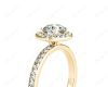 Round cut halo diamond engagement ring with four claw setting in 18K Yellow