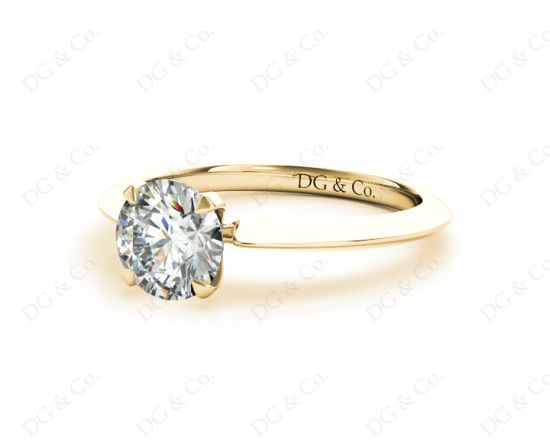 Round Cut Solitaire Diamond Engagement Ring with Four Prong set centre stone and a Knife Edge Band in 18K Yellow