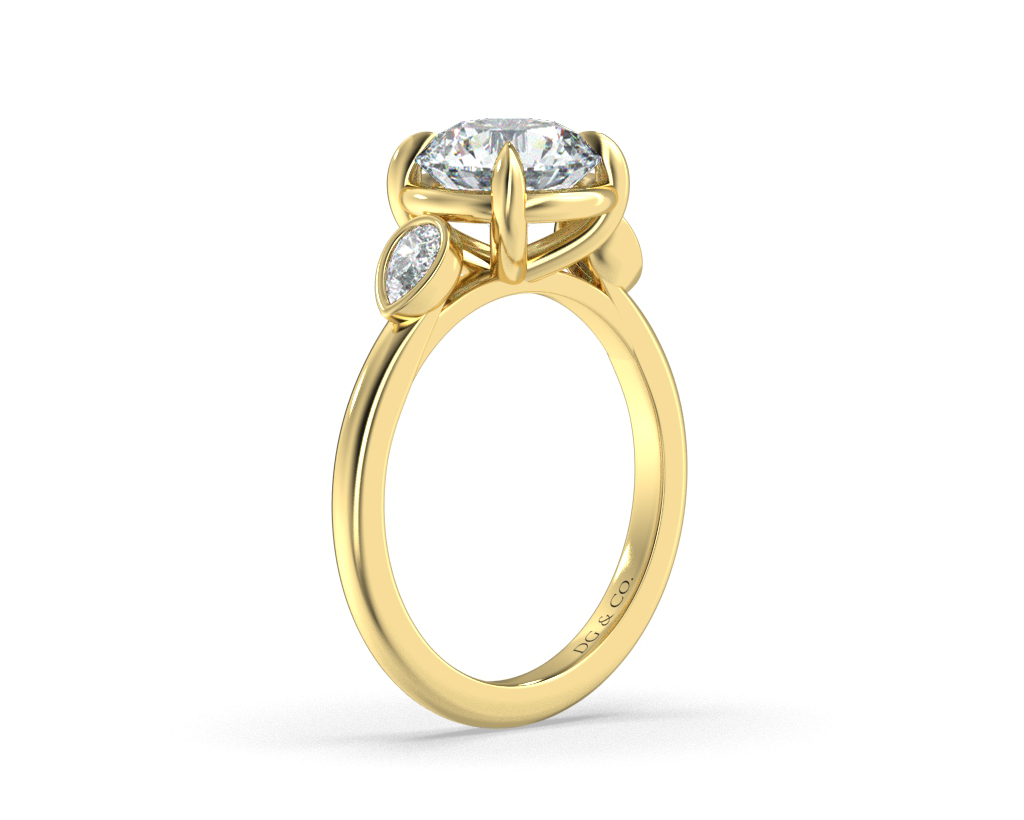 Sima Three stone Round Cut Bezel Four Claw Setting with Pear Shape Cut Side stones -18K Yellow