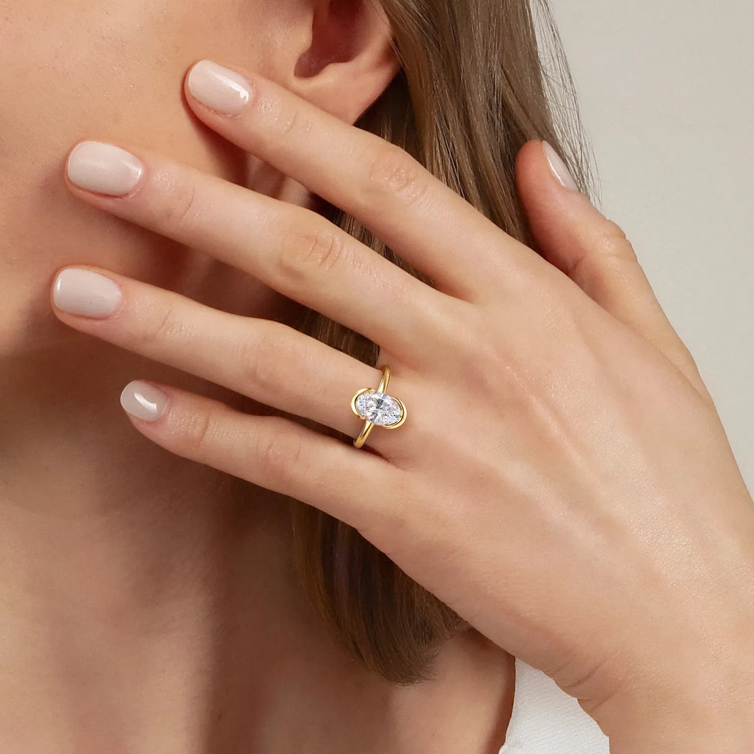Amari Solitaire split band Oval Cut Diamond Bezel Setting Engagement Ring - 18K Yellow
