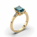 18K Yellow Gold Emerald Cut Teal Sapphire Ring with 2 Tapered-cut baguette Diamond - DG & Co. Jewellery