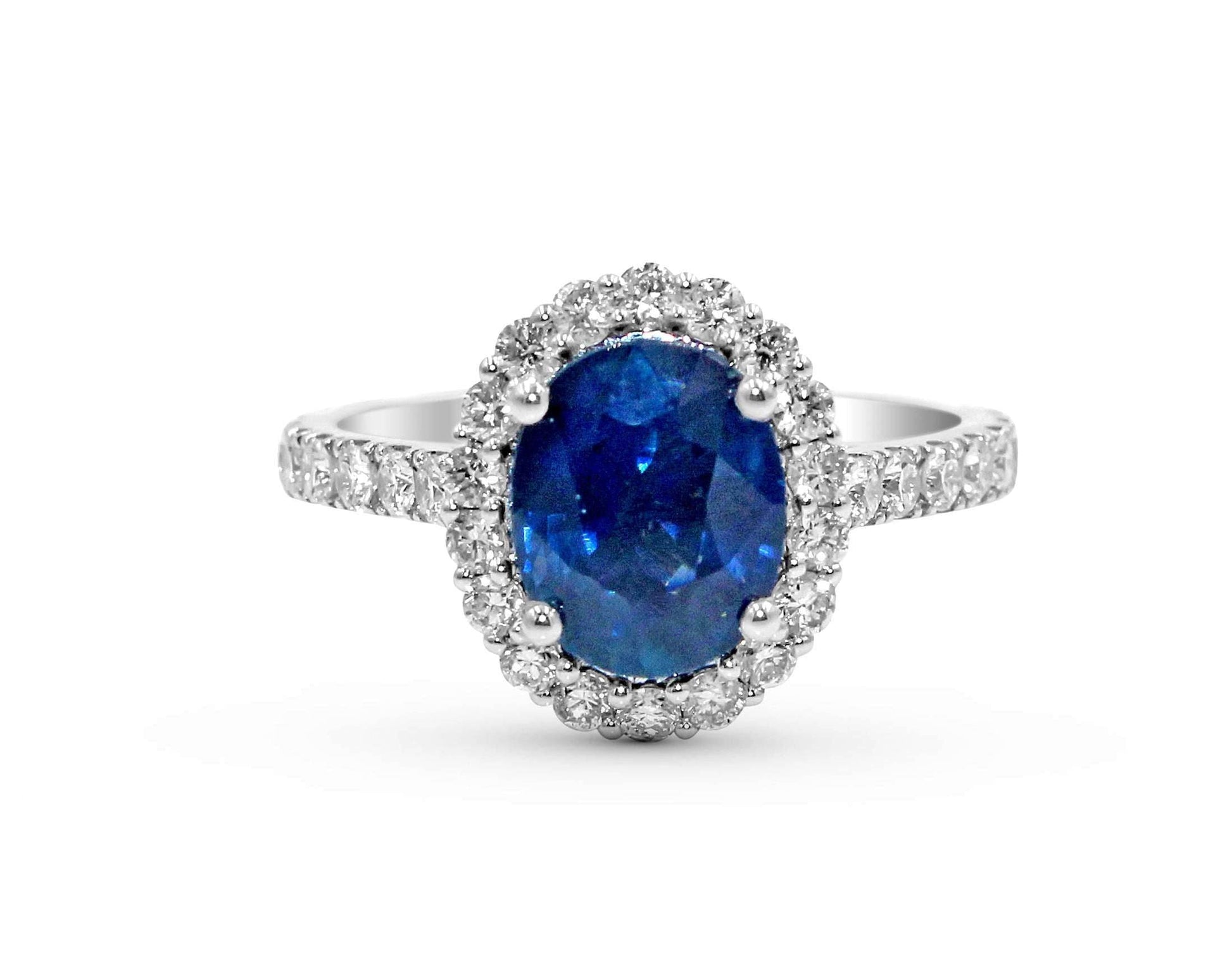 Halo Blue Sapphire Oval Cut Diamond Engagement Ring In 18 Karat White Gold - DG & Co. Jewellery