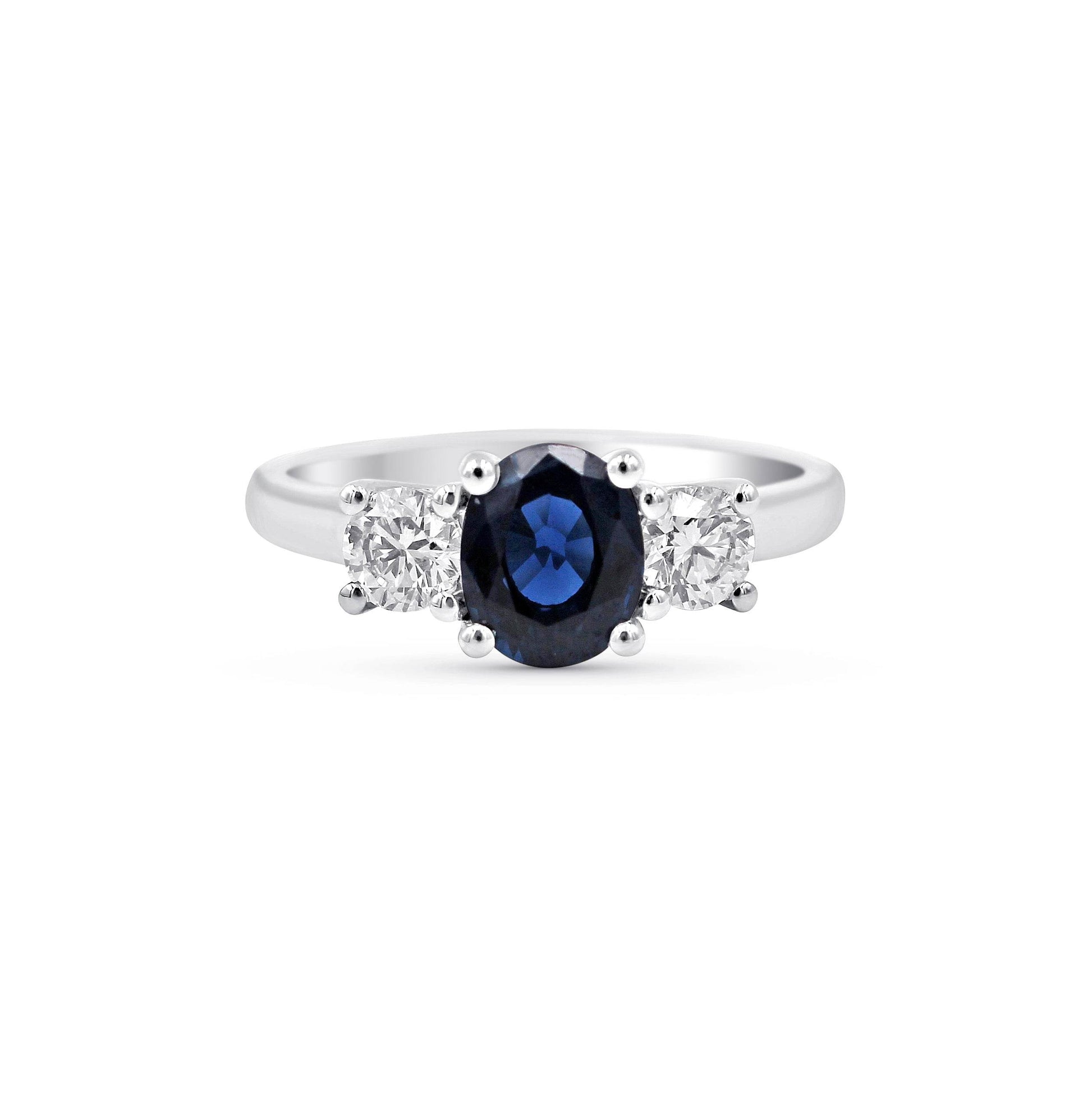 1.00CT Blue Sapphire Trilogy Oval Cut 4 Claw Setting Diamond Engagement Ring In 18K White Gold - DG & Co. Jewellery