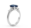 Emerald Cut Ceylon Blue Sapphire Diamond Engagement Ring with Tapered Diamond Shoulder In 18K White Gold - DG & Co. Jewellery