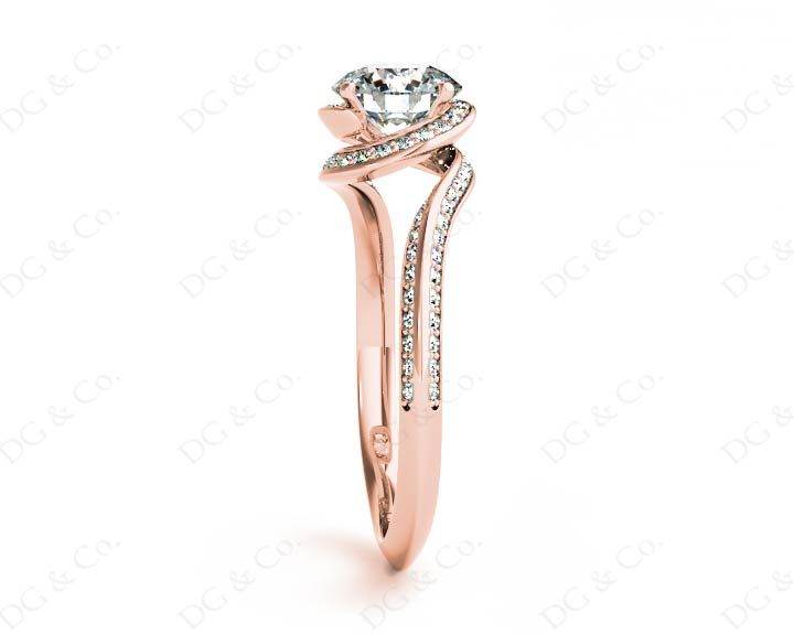 Round Cut Twist band claw set diamond with grain set side stone in 18K Rose - DG & Co. Jewellery