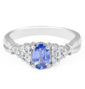 Vintage Style Oval Cut Tanzanite Diamond Ring in 18 Karat White Gold With a Round Cut Diamond Side Stones - DG & Co. Jewellery