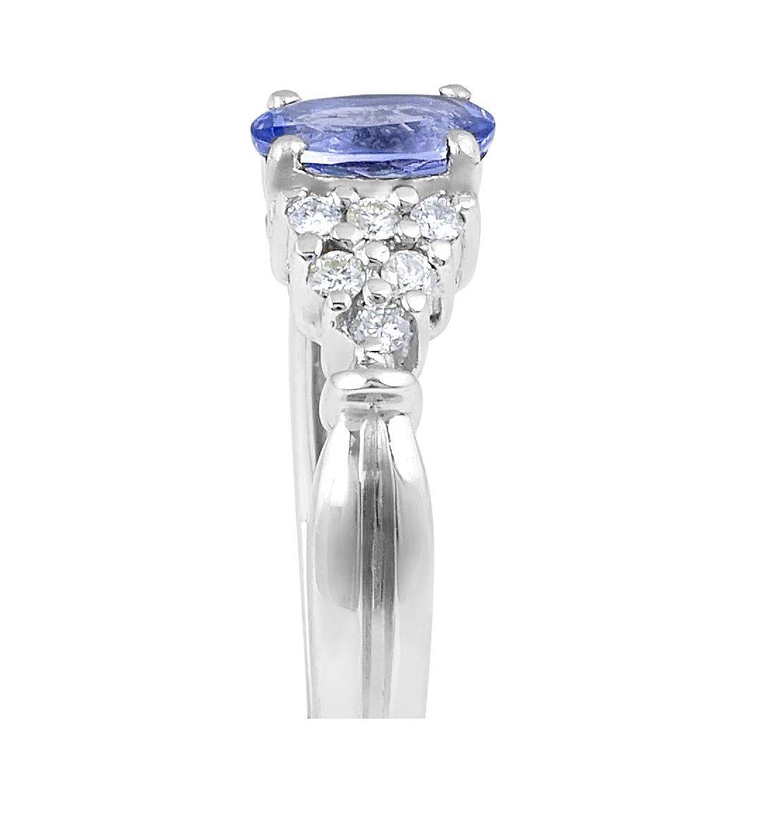 Vintage Style Oval Cut Tanzanite Diamond Ring in 18 Karat White Gold With a Round Cut Diamond Side Stones - DG & Co. Jewellery