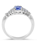 Vintage Style Oval Cut Tanzanite Diamond Ring in 18 Karat White Gold With a Round Cut Diamond Side Stones - DG & Co. Jewellery