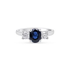 Round Cut Trilogy Blue Sapphire Engagement Ring In 18 Karat White Gold