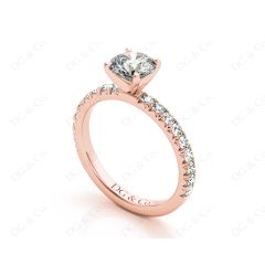 Round cut claw set diamond ring with pave set side stone in 18K Rose