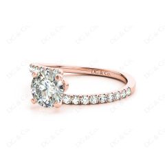 Round cut diamond cross over ring claw set diamond with pave set side stone in 18K Rose