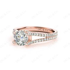 Round cut diamond ring with claw set centre stone in 18K Rose