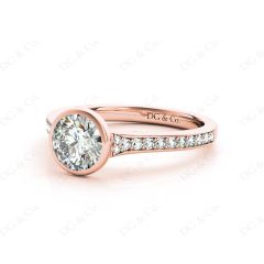 Round Cut Bezel Set Diamond Ring with Pave Set Diamonds Down the Shoulders in 18K Rose