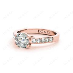 Round Cut 4 Claw Side Stone Engagement Ring with Channel Set Side Stones in 18K Rose