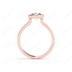 Round Cut Bezel Set Solitaire Engagement Ring With a Plain Band in 18K Rose