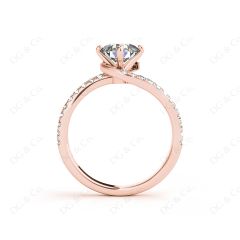 Round Cut Split Shank Diamond Engagement Ring with a Twist Band and Pave Set Side Stones in 18K Rose