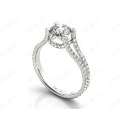 Round cut diamond ring with claw set centre stone in 18K White