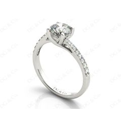 Round Cut Four Claw Set Diamond Ring with Pave Set Diamonds Down the Shoulders in Platinum