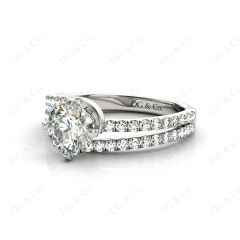 Round Cut Split Shank Diamond Engagement Ring with a Twist Band and Pave Set Side Stones in Platinum