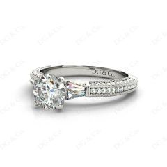 Round Cut Four Claw Set Diamond Ring with Pave Set Stones Down the Shoulders in 18K White