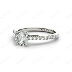 Round Cut Four Claw Set Diamond Ring with Round Pave Set Stones Down the Shoulders in 18K White