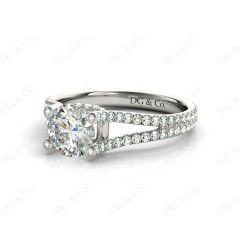 Round cut diamond ring with claw set centre stone in Platinum