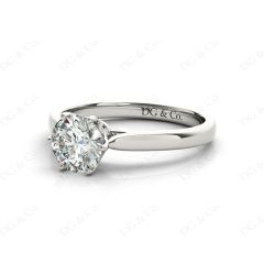 Round Cut Six Claw Set Diamond Ring on a Plain Band in Platinum