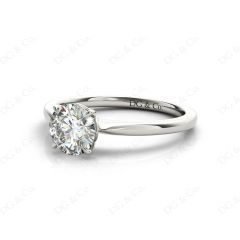 Round Cut Four Claw Set Diamond Ring With a Plain Band in Platinum