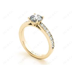 Round Cut Four Claws Set Diamond Ring with Channel Set Side Stones in 18K Yellow