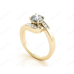 Round Cut Four Claw Set Diamond Ring with Channel Set Stones Down the Shoulders in 18k Yellow