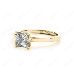 Princess cut classic diamond engagement ring in four claw setting in 18K Yellow