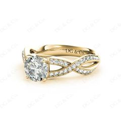 Round Cut Four Claw Set Diamond Ring with Pave Set Stones Down the Shoulders in 18K Yellow