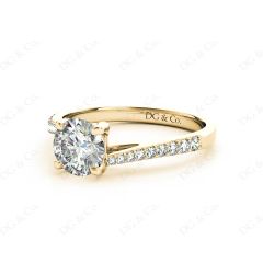 Round Cut Four Claw Set Diamond Ring with Pave Set Diamonds Down the Shoulders in 18K Yellow