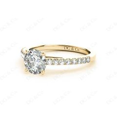 Round Cut Four Claw Set Diamond Ring with Round Pave Set Stones Down the Shoulders in 18K Yellow