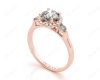 Round Cut Halo Trilogy diamond ring with pave set side stone in 18K Rose