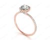 Round Cut Cross Over ring claw set diamond with pave set side stone in 18K Rose