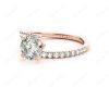 Round cut diamond cross over ring claw set diamond with pave set side stone in 18K Rose