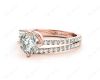 Round Cut Split Shank Diamond Engagement Ring with a Twist Band and Pave Set Side Stones in 18K Rose