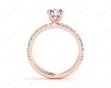 Round cut claw set diamond ring with pave set side stone in 18K Rose