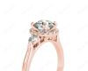 Round Cut Halo Trilogy diamond ring with pave set side stone in 18K Rose