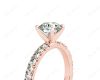 Round cut claw set diamond ring with pave set side stone in 18K Rose