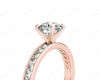 Round Cut Four Claw Set Diamond Ring with Channel Set Side Stones Down the Shoulders in 18k Rose